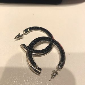 Silver hoop earrings with black beaded detail